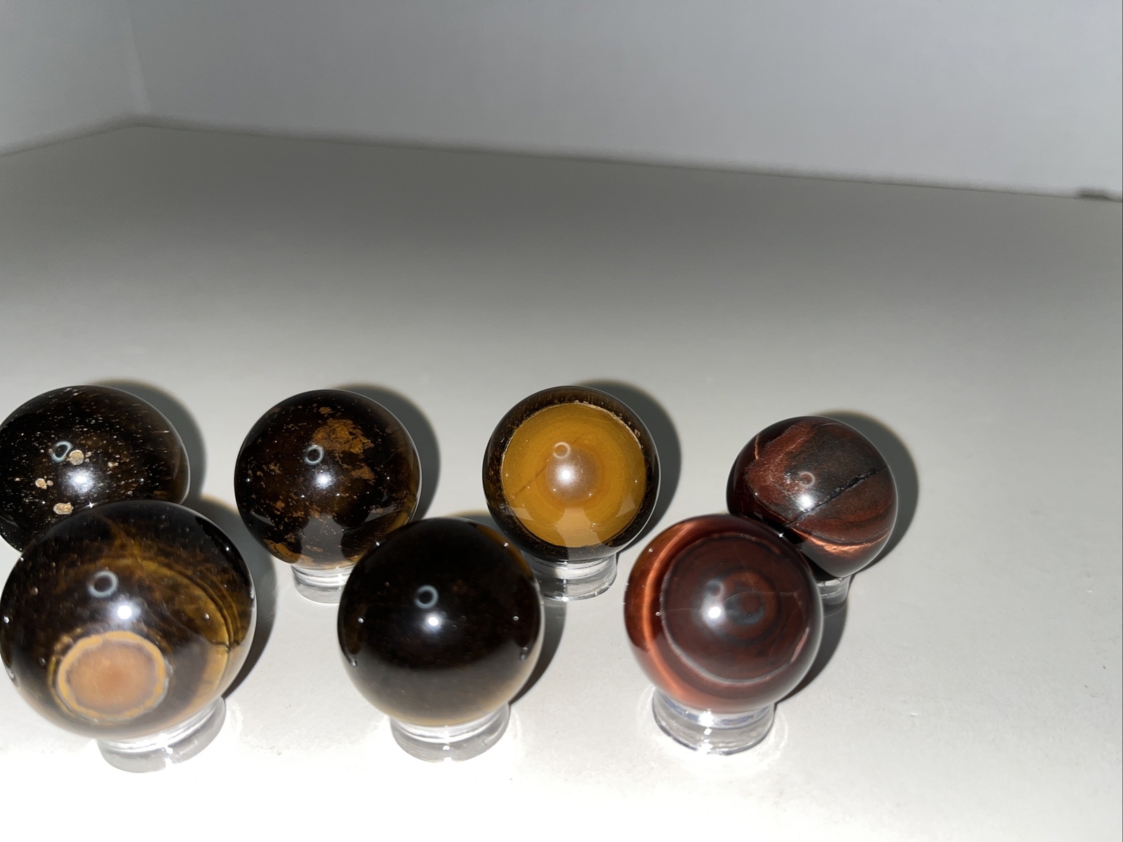 Sphere lot/tigers eye with acrylic stands.