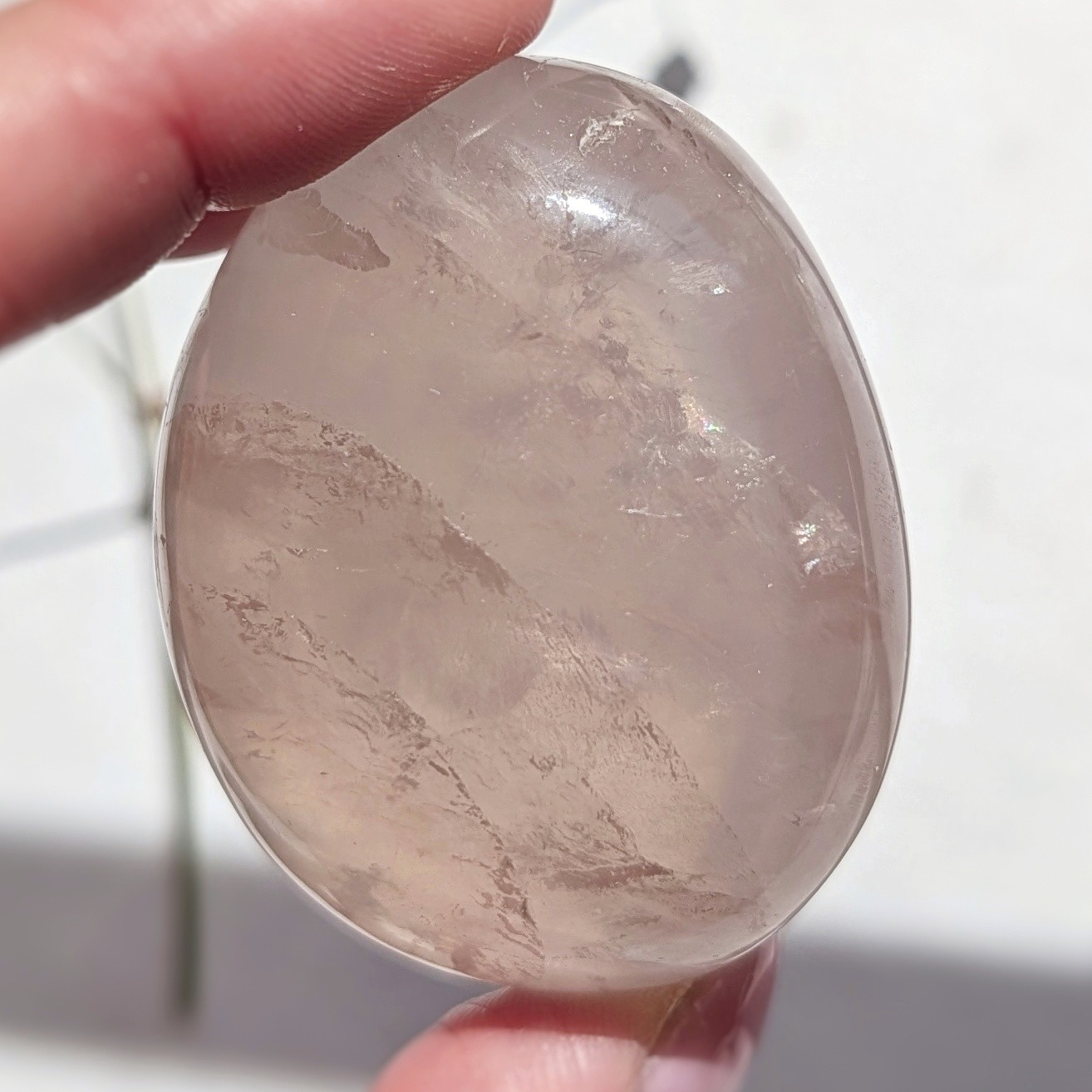 2″ translucent rose quartz palmstone with rainbow and asterism, star rose quartz