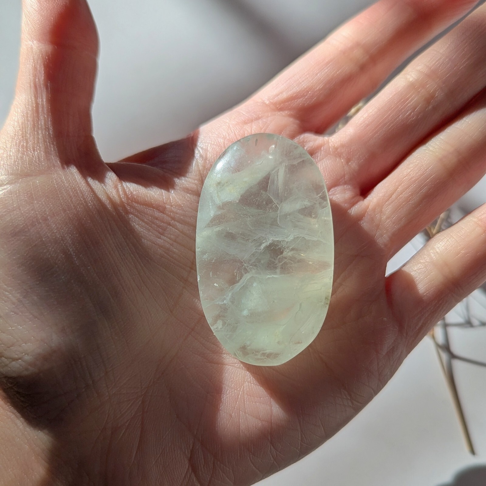 2″ ethereal mint green translucent fluorite palmstone, fluorescent fluorite