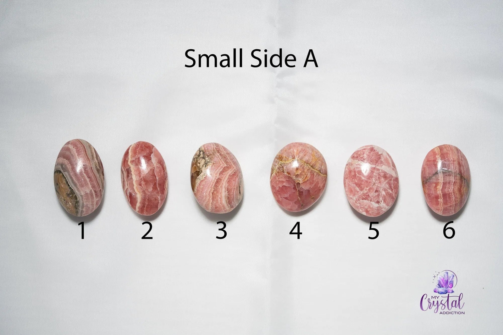Rhodochrosite Palm Stone – Puffy