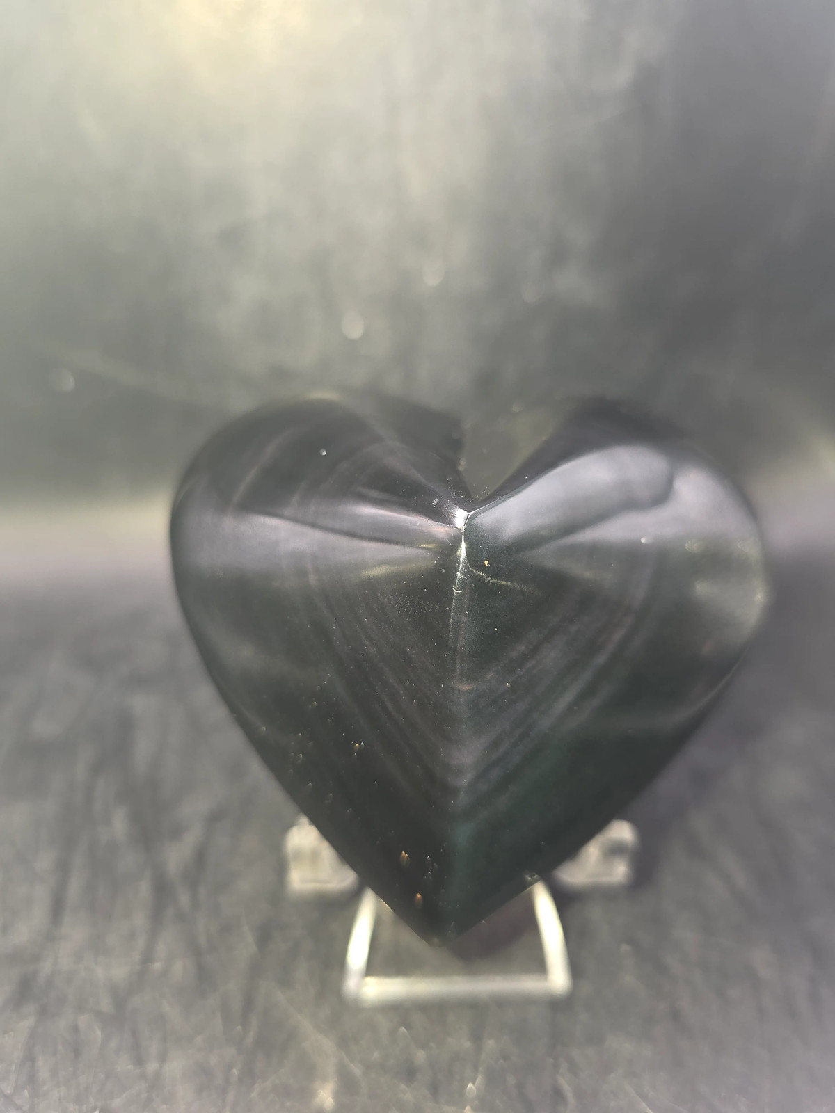 Rainbow obsidian heart! 10 ounces, 3 inches wide, 2.8″ tall